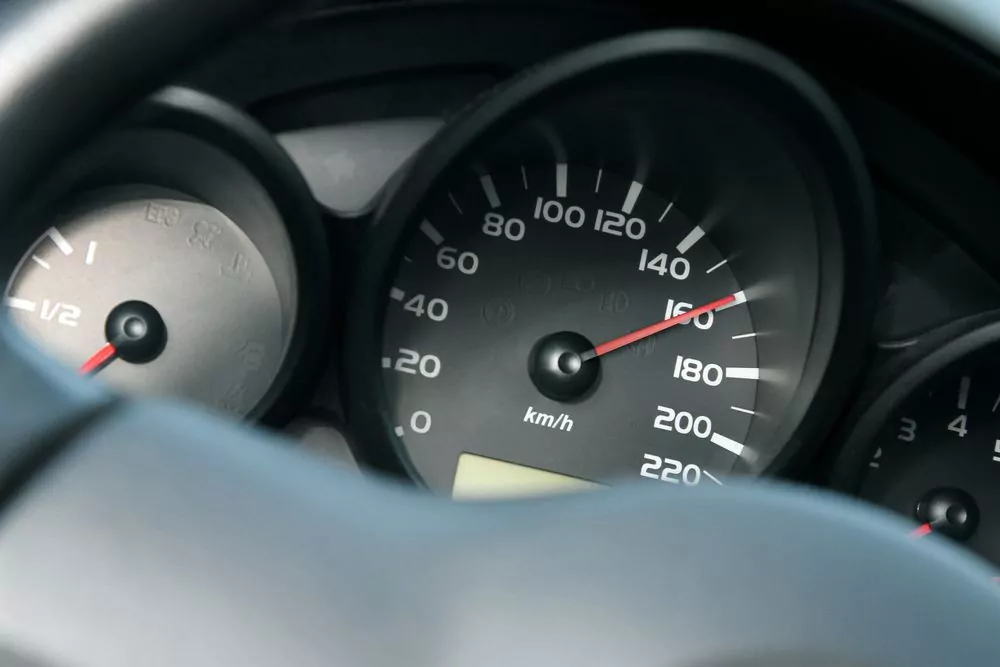 car speedometer going 160 km/h